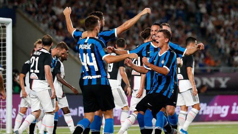  FC Internazionale players celebrate their first goal scored by Matthijs de Ligt of Juventus (not pictured) during the International Champions Cup match between Juventus and FC Internazionale at the Nanjing Olympic Center Stadium on July 24, 2019 in Nanjing, China.