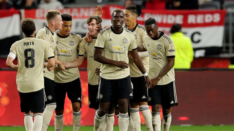 James Garner is congratulated after firing United's second goal against Perth Glory