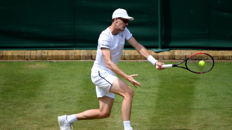 Jamie Murray of Great Britain partner of Neal Skupski of Great Britain returns the ball in their Men's Doubles first round match against Ivan Dodig of Croatia and Filip Polasek of Slovakia during Day five of The Championships - Wimbledon 2019 at All England Lawn Tennis and Croquet Club on July 05, 2019 in London, England.