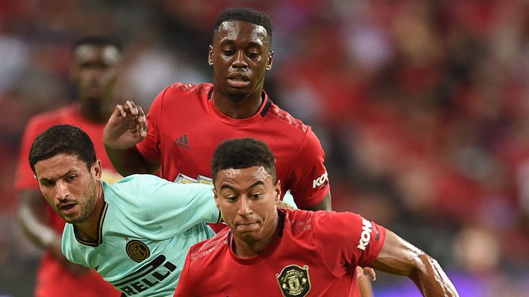 Manchester United's Jesse Lingard (front) runs after the ball during the International Champions Cup football match between Manchester United and Inter Milan in Singapore on July 20, 2019. (Photo by Roslan RAHMAN / AFP) (Photo credit should read ROSLAN RAHMAN/AFP/Getty Images)