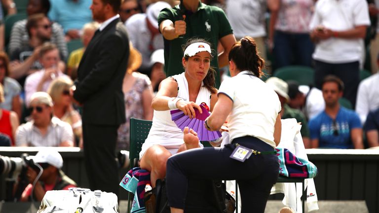 Johanna Konta of Great Britain receives treatment in her Ladies' Singles fourth round match against Petra Kvitova of The Czech Republic during Day Seven of The Championships - Wimbledon 2019 at All England Lawn Tennis and Croquet Club on July 08, 2019 in London, England