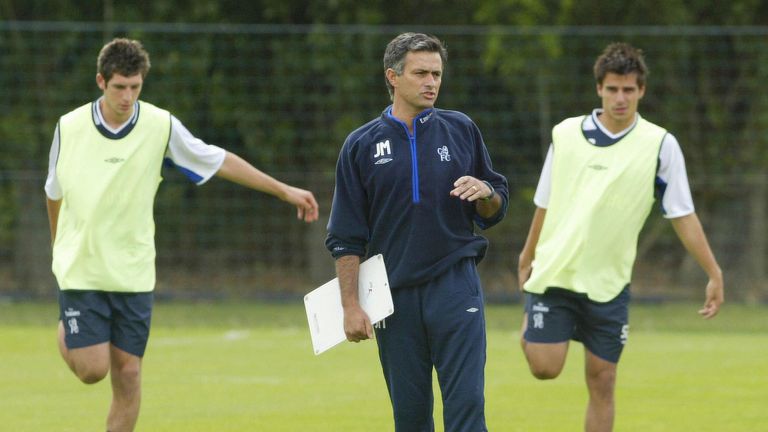Chelsea football team's newly appointed manager Jose Mourinho (C) watches his players at the training session at Chelsea football team's training grounds at Harlington, 05 July 2004, ahead of the English Football Season.
