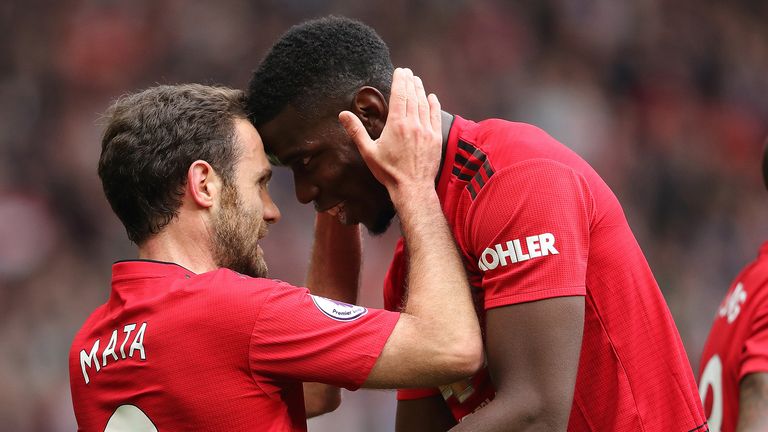 Juan Mata of Manchester United celebrates after scoring a goal to make it 1-0 with Paul Pogba during the Premier League match between Manchester United and Chelsea FC at Old Trafford on April 28, 2019 in Manchester, United Kingdom.