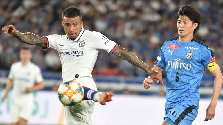 Chelsea's midfielder Kenedy (L) kicks the ball as Frontale's midfielder Shogo Taniguchi 