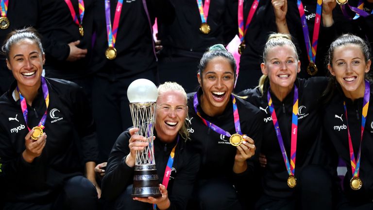 Laura Langman elated with her teammates and the Netball World Cup trophy