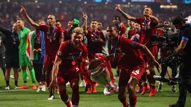 Oxlade-Chamberlain and Brewster celebrate after winning the Champions League final in Madrid