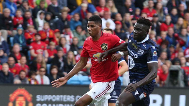 Manchester United striker Marcus Rashford is challenged by Kristiansund's Aliou Coly