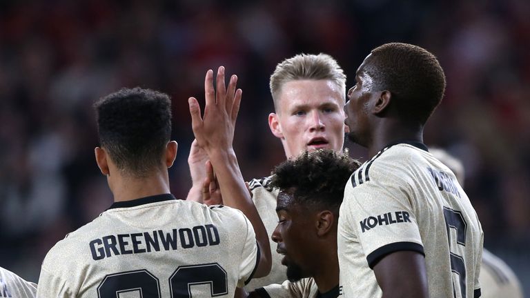 PERTH, AUSTRALIA - JULY 13: Paul Pogba and Scott McTominay of Manchester United celebrate Marcus Rashford scoring their first goal during the match between the Perth Glory and Manchester United at Optus Stadium on July 13, 2019 in Perth, Australia. (Photo by John Peters/Manchester United via Getty Images)