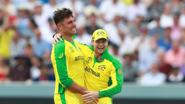 Marcus Stoinis (L) celebrates with team mate Steve Smith after taking the wicket of Jos Buttler during the Group Stage match of the ICC Cricket World Cup 2019 between England and Australia at Lords on June 25, 2019 in London, England. 