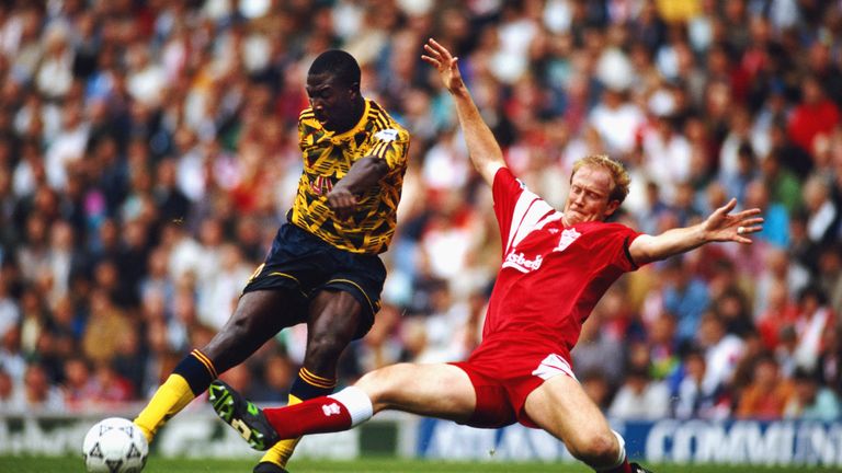 Liverpool's Mark Wright puts a tackle in on Arsenal's Kevin Campbell