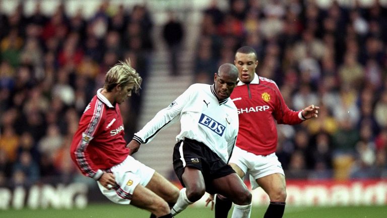 Derby County's Marvin Robinson contests the ball with Manchester United's David Beckham