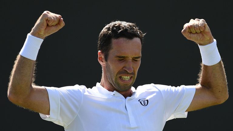 Kazakhstan's Mikhail Kukushkin celebrates beating US player John Isner during their men's singles second round match on the fourth day of the 2019 Wimbledon Championships at The All England Lawn Tennis Club in Wimbledon, southwest London, on July 4, 2019. 