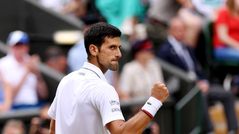 Novak Djokovic celebrates winning the first set