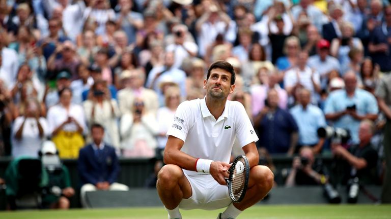 Novak Djokovic takes in the surroundings at the end of the classic match on Centre Court
