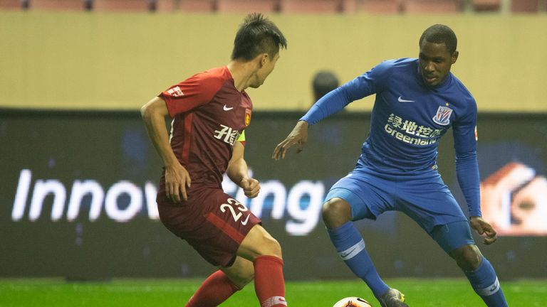 Odion Ighalo taking on a defender while playing for Shanghai Shenhua