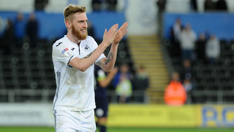 Oli McBurnie of Swansea City applauds the fans at the final whistle during the Sky Bet Championship match between Swansea City and Derby County at the Liberty Stadium on May 01, 2019 in Swansea, Wales