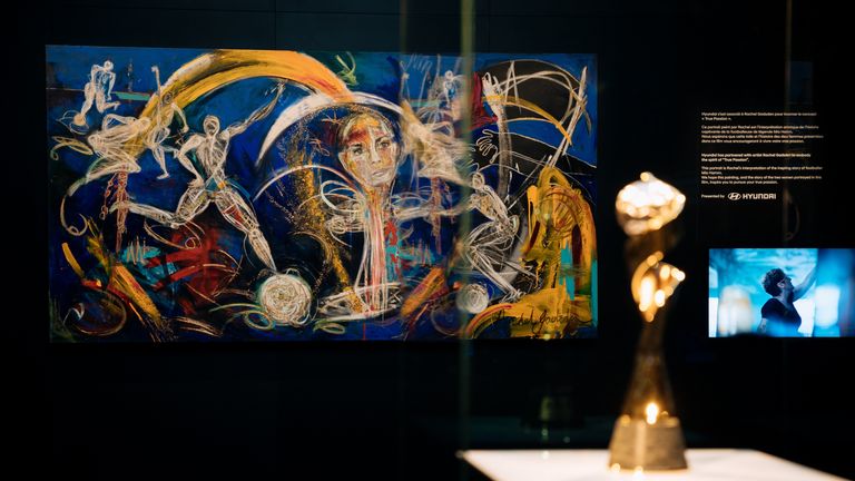 Gadsden's painting is displayed alongside the World Cup trophy