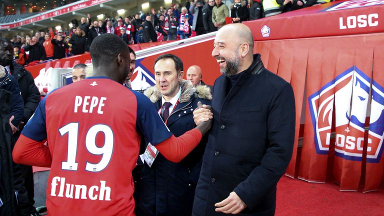 LILLE, FRANCE - APRIL 14: President of Lille Gerard Lopez congratulates Nicolas Pepe of Lille following the French Ligue 1 match between Lille OSC (LOSC) and Paris Saint-Germain (PSG) at Stade Pierre Mauroy on April 14, 2019 in Lille, France. (Photo by Jean Catuffe/Getty Images)