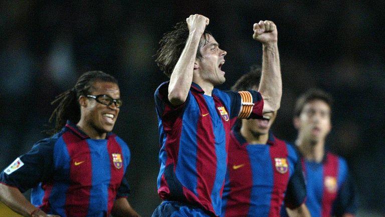 Phillip Cocu celebrates scoring a goal for Barcelona