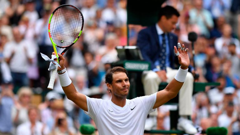 Rafael Nadal celebrates beating France's Jo-Wilfried Tsonga during their men's singles third round match on the sixth day of the 2019 Wimbledon Championships at The All England Lawn Tennis Club in Wimbledon, southwest London, on July 6, 2019.