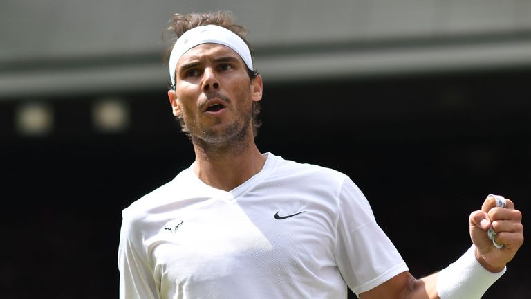 Rafael Nadal celebrates after winning a point against Portugal's Joao Sousa during their men's singles fourth round match on the seventh day of the 2019 Wimbledon Championships at The All England Lawn Tennis Club in Wimbledon, southwest London, on July 8, 2019