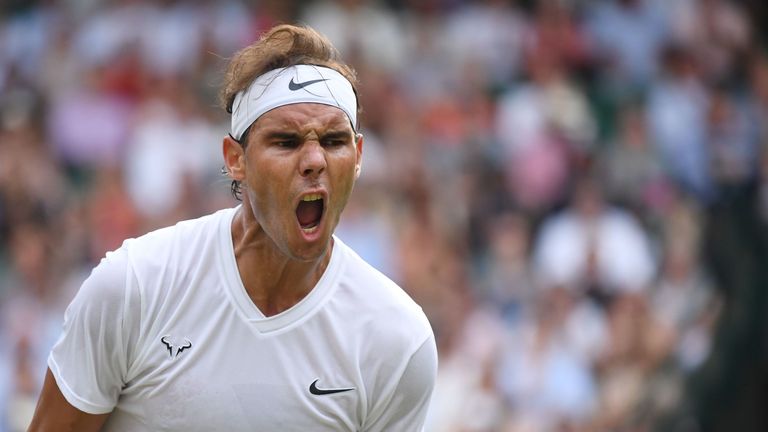 Rafael Nadal celebrates after winning a point against US player Sam Querrey during their men's singles quarter-final match on day nine of the 2019 Wimbledon Championships at The All England Lawn Tennis Club in Wimbledon, southwest London, on July 10, 2019