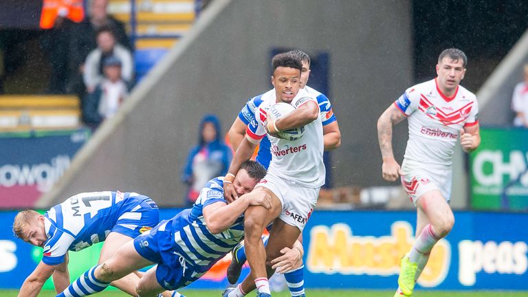 St Helens' Regan Grace carries the ball forward against Halifax