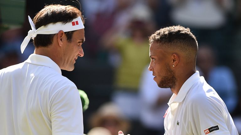 Roger Federer (L) greets Britain's Jay Clarke after beating him during their men's singles second round match on the fourth day of the 2019 Wimbledon Championships at The All England Lawn Tennis Club in Wimbledon, southwest London, on July 4, 2019. 