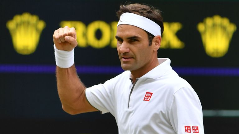 Roger Federer celebrates beating France's Lucas Pouille during their men's singles third round match on the sixth day of the 2019 Wimbledon Championships at The All England Lawn Tennis Club in Wimbledon, southwest London, on July 6, 2019. 