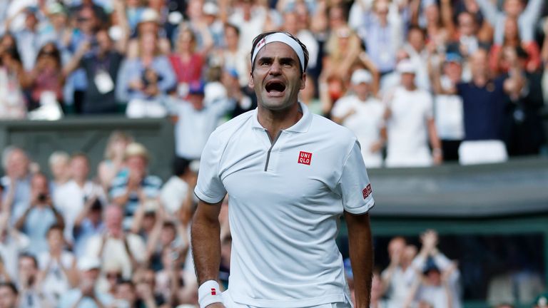 Switzerland's Roger Federer celebrates beating Spain's Rafael Nadal during their men's singles semi-final match on day 11 of the 2019 Wimbledon Championships at The All England Lawn Tennis Club in Wimbledon, southwest London, on July 12, 2019. (Photo by Adrian DENNIS / POOL / AFP) / RESTRICTED TO EDITORIAL USE