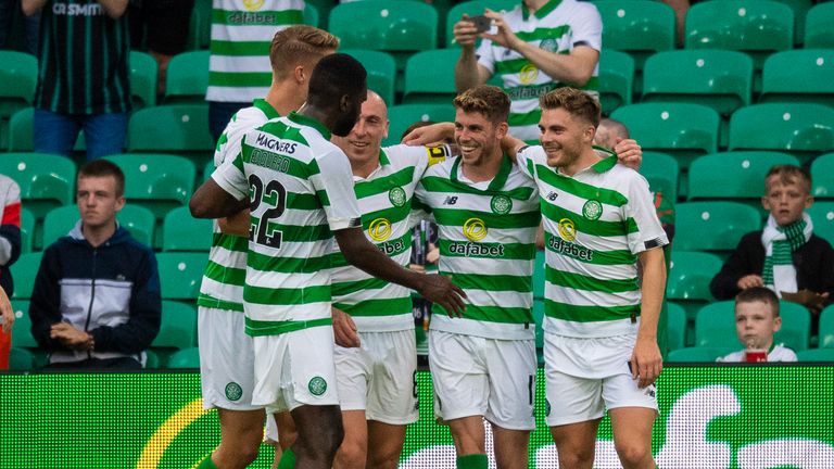 Celtic's Ryan Christie celebrates with teammates after he makes it 2-0 from the penalty spot