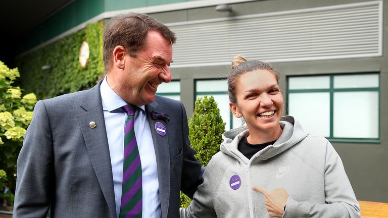 Simona Halep is presented with her lifelong membership badge for the All England Lawn Tennis Club by outgoing chairman Philip Brook