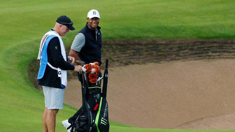 Woods and his caddie Joe LaCava assess the conditions at Royal Portrush