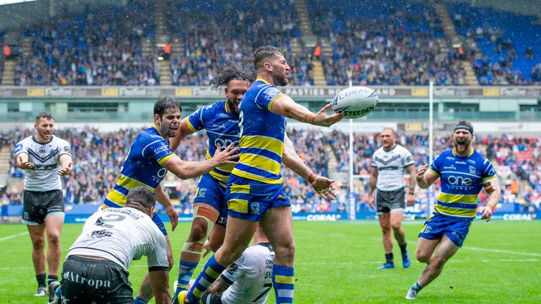 Warrington's Toby King celebrates scoring a try against Hull FC.