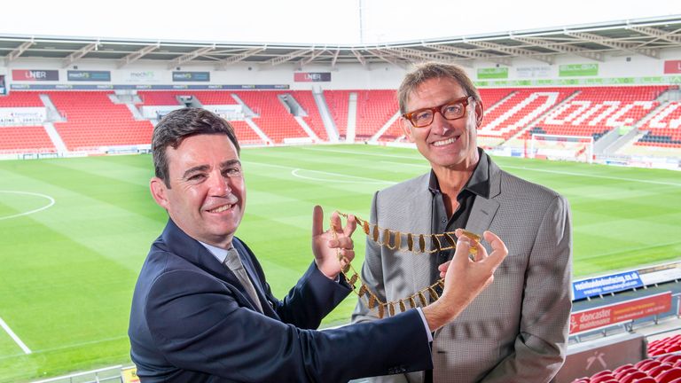 Picture by Allan McKenzie/SWpix.com - 24/07/2019 - Rugby League - Rugby Football League Council Meeting - The Keepmoat Stadium, Doncaster, England - Andy Burnham hands the presidential chains of the Rugby Football League over to Tony Adams.