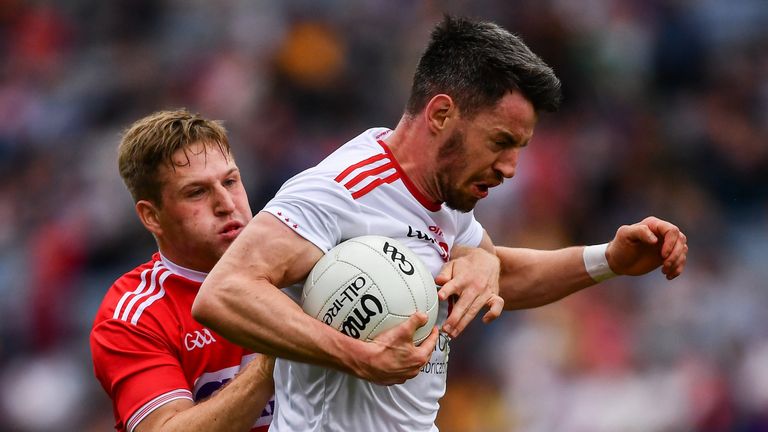 Mattie Donnelly of Tyrone in action against Liam O'Donovan of Cork