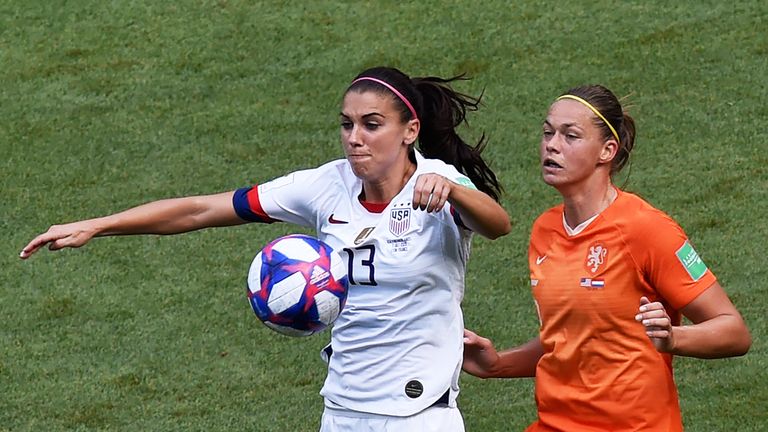 Alex Morgan vies for the ball against Netherlands