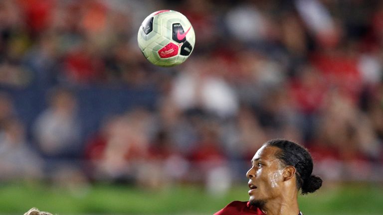 Liverpool defender Virgil van Dijk battles for the ball with Bruun Larsen