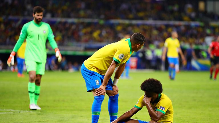 Brazil forward Willian sits on the floor after suffering an injury in the Copa America semi-final win over Argentina