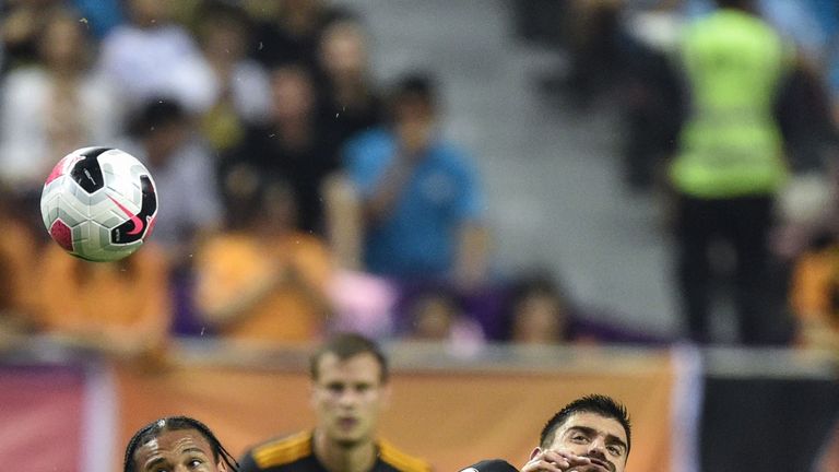 Ruben Neves (right) and Leroy Sane challenge for the ball