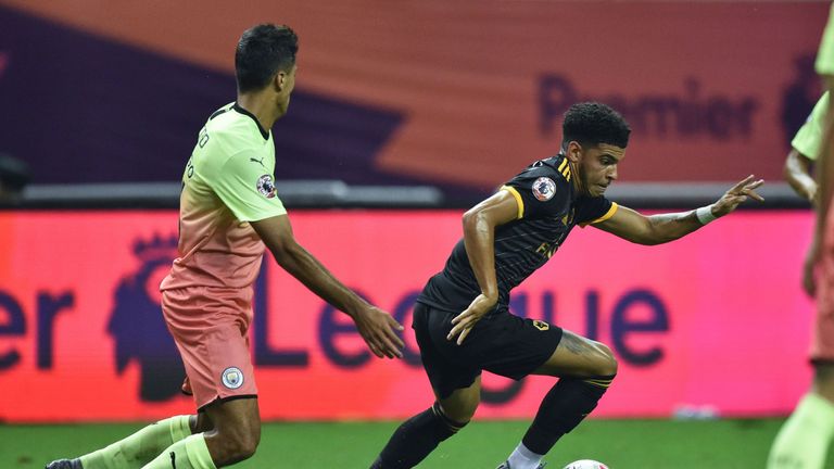 Wolverhampton Wanderers' Morgan Gibbs-White (R) runs with the ball against Manchester City during their final match of the 2019 Premier League Asia Trophy football tournament at the Hongkou Stadium in Shanghai on July 20, 2019. (Photo by HECTOR RETAMAL / AFP) (Photo credit should read HECTOR RETAMAL/AFP/Getty Images)