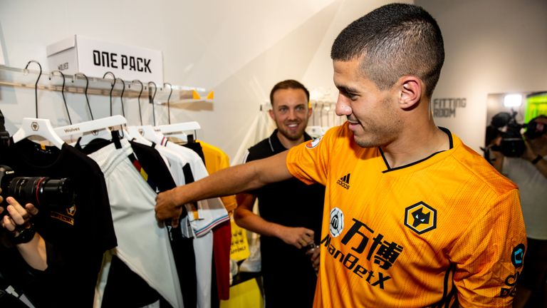 Cono Coady wore Wolves' new home kit at a Shanghai event