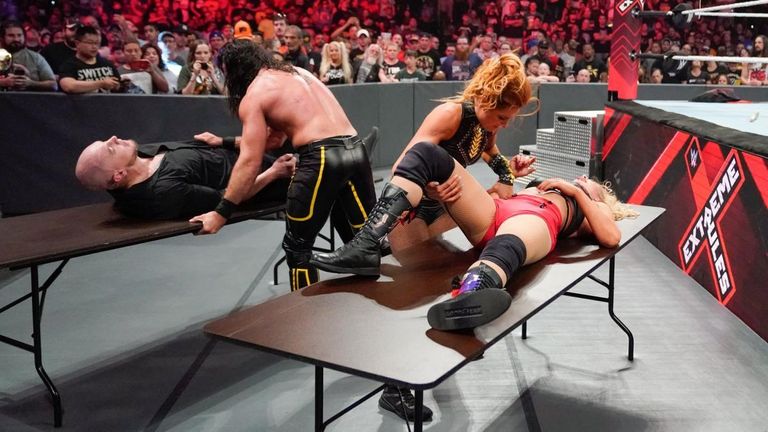 becky lynch and seth rollins with tables at wwe extreme rules 2019