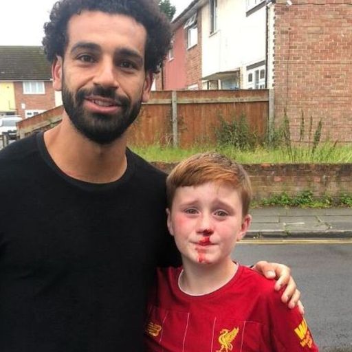 Salah poses with boy who ran into lamp post