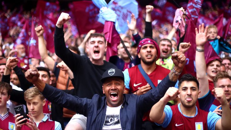 Aston Villa fans celebrate after winning the Sky Bet Championship Play-off Final match between Aston Villa and Derby County at Wembley Stadium on May 27, 2019 