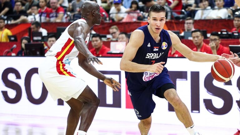 Bogdan Bogdanovic drives at the heart of the Angola defense