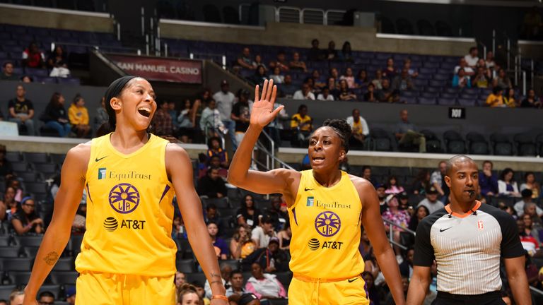 Candace Parker and Nneka Ogwunike celebrate the Sparks' win over the Mercury