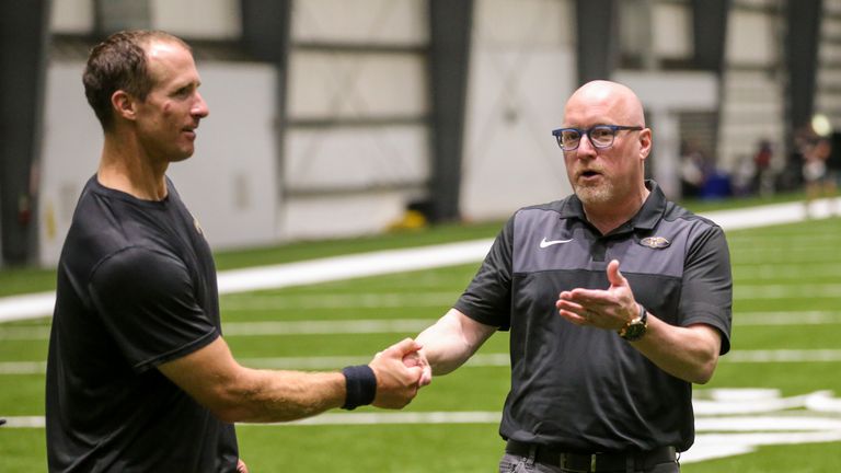David Griffin attends a New Orleans Saints practice with Drew Brees
