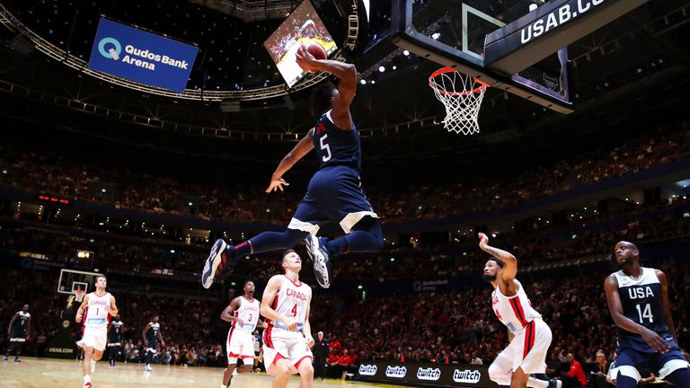 Donovan Mitchell skies for an alley-oop slam against Canada