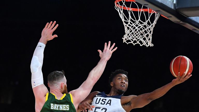 Donovan Mitchell elevates to the rim against the Boomers